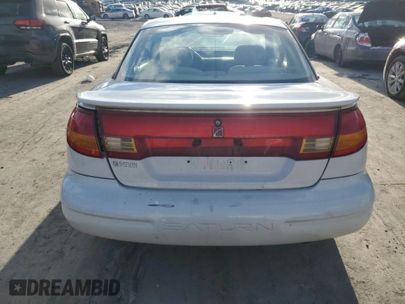 1999 Saturn SC z VIN 1G8ZR1275XZ375833, wystawiony jako Copart lot #87960885 z przebiegiem 97 697 mil mil oraz Szkody całkowita. Historia ofert i sprzedaży dostępna na DreamBid. Obrazek 6.