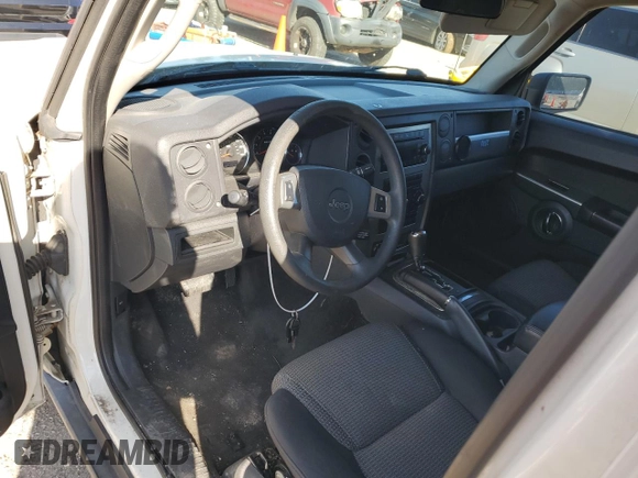 2010 Jeep Commander Sport with VIN 1J4RH4GK9AC113888, listed as a Copart auction lot 84553544 with 208,109 mi miles and Salvage title. Bid and sale history available at DreamBid. Image 8.