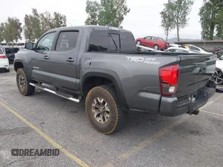 2018 Toyota Tacoma SR5 with VIN 3TMAZ5CN1JM071396, listed as a IAAI auction lot 42061640 with 122,148 mi miles and . Bid and sale history available at DreamBid. Image 3.
