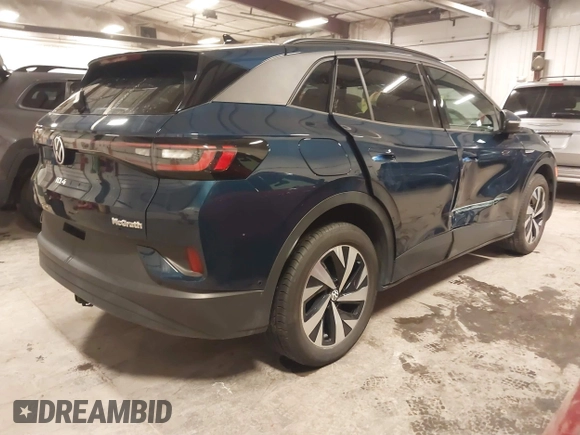 2023 Volkswagen ID.4 Pro z VIN 1V2DNPE84PC038042, wystawiony jako IAAI lot #41446269 z przebiegiem 12 878 mil mil oraz . Historia ofert i sprzedaży dostępna na DreamBid. Obrazek 4.