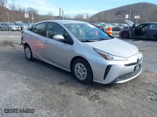 2021 Toyota Prius L Eco with VIN JTDKAMFU7M3143961, listed as a IAAI auction lot 41486032 with 58,979 mi miles. Bid and sale history available at carsss.com. Image 1.
