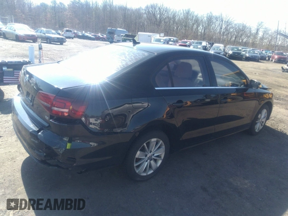 2016 Volkswagen Jetta Sedan 1.4T SE with VIN 3VWD67AJXGM242539, listed as a IAAI auction lot 38948493 with 121,876 mi miles. Bid and sale history available at carsss.com. Image 4.