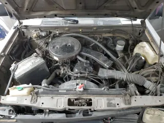 1987 Nissan Hardbody E z VIN JN6ND11S3HW057122, wystawiony jako Copart lot #73303004 z przebiegiem 233 309 mil mil oraz Szkody całkowita. Historia ofert i sprzedaży dostępna na DreamBid. Obrazek 12.