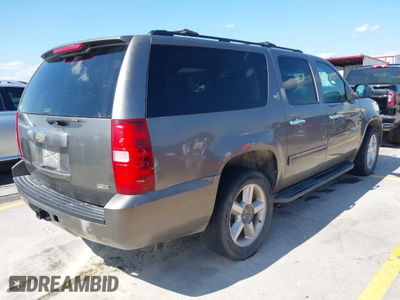 2011 Chevrolet Suburban LT with VIN 1GNSCJE03BR396610, listed as a IAAI auction lot 42348029 with 249,280 mi miles and . Bid and sale history available at DreamBid. Image 4.