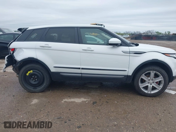 2014 Land Rover Range Rover Evoque Pure Plus z VIN SALVP2BG5EH900420, wystawiony jako IAAI lot #41940049 z przebiegiem 136 916 mil mil oraz . Historia ofert i sprzedaży dostępna na DreamBid. Obrazek 13.