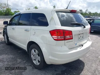 2013 Dodge Journey Canada Value z VIN 3C4PDCAB1DT646810, wystawiony jako IAAI lot #42484918 z przebiegiem 212 456 mil mil oraz . Historia ofert i sprzedaży dostępna na DreamBid. Obrazek 3.