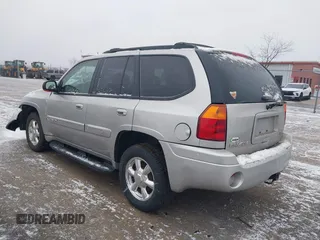 2005 GMC Envoy SLT with VIN 1GKDT13S352258640, listed as a IAAI auction lot 41226997 with 159,665 mi miles. Bid and sale history available at carsss.com. Image 3.
