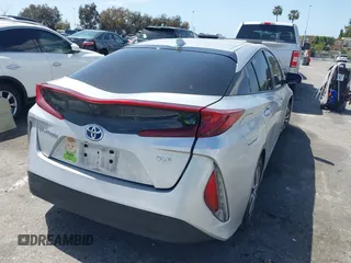 2021 Toyota Prius LE with VIN JTDKAMFP1M3180370, listed as a IAAI auction lot 41928512 with 83,249 mi miles and . Bid and sale history available at DreamBid. Image 4.