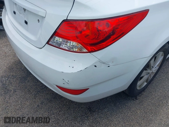 2014 Hyundai Accent GLS with VIN KMHCU4AE8EU608539, listed as a IAAI auction lot 41946784 with 106,709 mi miles and . Bid and sale history available at carsss.com. Image 16.
