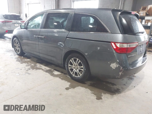 2012 Honda Odyssey EX-L with VIN 5FNRL5H63CB137198, listed as a IAAI auction lot 42706690 with 305,753 mi miles and . Bid and sale history available at DreamBid. Image 3.