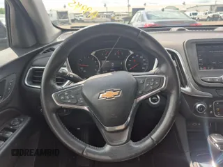 2021 Chevrolet Equinox LT z VIN 3GNAXJEV2ML379402, wystawiony jako IAAI lot #42504649 z przebiegiem 58 647 mil mil oraz . Historia ofert i sprzedaży dostępna na DreamBid. Obrazek 6.