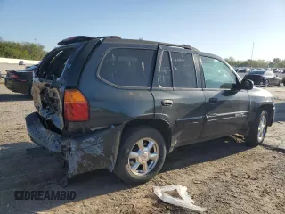 2004 GMC Envoy SLE with VIN 1GKDT13S042404250, listed as a Copart auction lot 52672455 with 230,610 mi miles and Salvage Title. Bid and sale history available at carsss.com. Image 3.