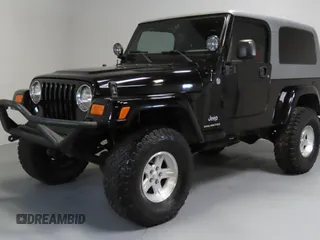 2005 Jeep Wrangler Unlimited with VIN 1J4FA44S75P305935, listed as a Copart auction lot 52035455 with 116,569 mi miles and Salvage Title. Bid and sale history available at carsss.com. Image 2.