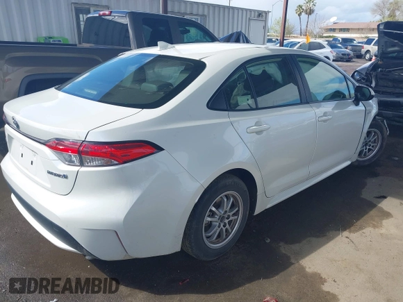 2021 Toyota Corolla Hybrid LE with VIN JTDEAMDE7MJ012694, listed as a IAAI auction lot 41794233 with 103,363 mi miles. Bid and sale history available at carsss.com. Image 4.