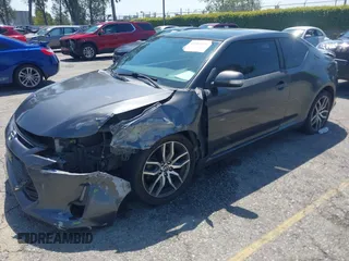 2015 Scion tC with VIN JTKJF5C74F3090309, listed as a IAAI auction lot 41988036 with 158,240 mi miles. Bid and sale history available at carsss.com. Image 2.