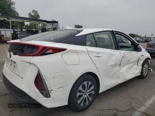 2021 Toyota Prius LE z VIN JTDKAMFP9M3196770, wystawiony jako Copart lot #54309555 z przebiegiem 21 948 mil mil oraz Szkoda całkowita • Salvage title. Historia ofert i sprzedaży dostępna na DreamBid. Obrazek 3.