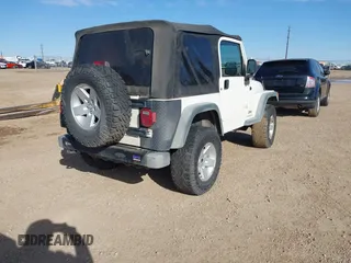 2005 Jeep Wrangler Sport with VIN 1J4FA49SX5P336380, listed as a IAAI auction lot 41752554 with 139,004 mi miles. Bid and sale history available at carsss.com. Image 4.