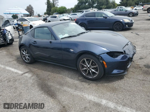 2021 Mazda MX-5 Miata Grand Touring with VIN JM1NDAM70M0460532, listed as a Copart auction lot 58828045 with 70,269 mi miles and Salvage title. Bid and sale history available at DreamBid. Image 4.