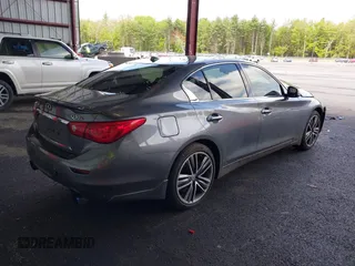 2015 Infiniti Q50 Premium z VIN JN1BV7AR3FM422042, wystawiony jako IAAI lot #42258784 z przebiegiem 72 030 mil mil oraz . Historia ofert i sprzedaży dostępna na DreamBid. Obrazek 4.