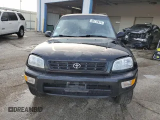 1999 Toyota RAV4 with VIN JT3GP10V9X7042801, listed as a Copart auction lot 82712874 with 256,151 mi miles and Salvage Title. Bid and sale history available at DreamBid. Image 5.