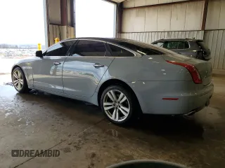 2013 Jaguar XJ with VIN SAJWJ1CD1D8V51462, listed as a Copart auction lot 50527985 with 62,995 mi miles and Salvage title. Bid and sale history available at DreamBid. Image 2.