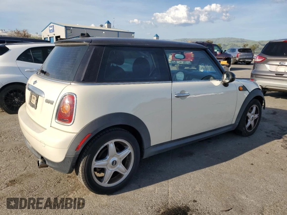 2010 MINI Hardtop with VIN WMWMF3C52ATZ65593, listed as a Copart auction lot 50107445 with 105,389 mi miles and Salvage title. Bid and sale history available at DreamBid. Image 3.
