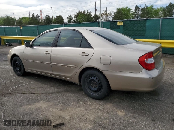 2002 Toyota Camry LE z VIN 4T1BE32K92U524457, wystawiony jako Copart lot #56864365 z przebiegiem 274 760 mil mil oraz Czysty tytuł • Clean title. Historia ofert i sprzedaży dostępna na DreamBid. Obrazek 2.