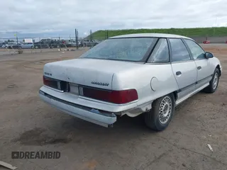 1991 Mercury Sable z VIN 1MECM50U6MG615570, wystawiony jako IAAI lot #41742946 z przebiegiem 19 426 mil mil oraz . Historia ofert i sprzedaży dostępna na DreamBid. Obrazek 4.