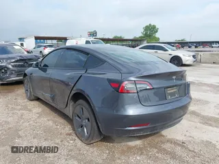 2023 Tesla Model 3 with VIN 5YJ3E1EA5PF676316, listed as a IAAI auction lot 42384765 with 33,715 mi miles and . Bid and sale history available at DreamBid. Image 3.