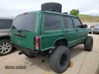 1998 Jeep Cherokee Sport with VIN 1J4FJ68SXWL210381, listed as a Copart auction lot 58398995 with 211,870 mi miles and Salvage title. Bid and sale history available at DreamBid. Image 3.