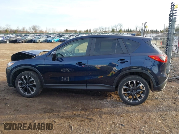 2016 Mazda CX-5 Grand Touring with VIN JM3KE4DY1G0823989, listed as a IAAI auction lot 41770149 with 40,677 mi miles. Bid and sale history available at carsss.com. Image 14.