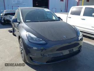 2025 Tesla Model Y Long Range with VIN 7SAYGDED2SF228414, listed as a IAAI auction lot 41706470 with 11,319 mi miles and . Bid and sale history available at DreamBid. Image 1.
