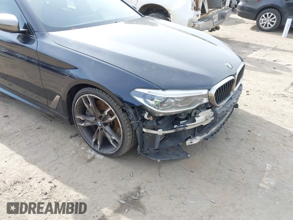 2018 BMW 5 Series M550i xDrive with VIN WBAJB9C50JB036400, listed as a IAAI auction lot 41464278 with 139,079 mi miles and . Bid and sale history available at DreamBid. Image 18.