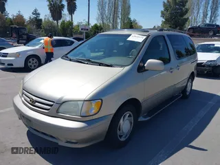 2001 Toyota Sienna LE with VIN 4T3ZF13C21U397063, listed as a IAAI auction lot 42033574 with 219,783 mi miles. Bid and sale history available at carsss.com. Image 6.