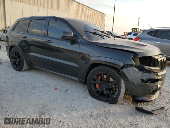 2012 Jeep Grand Cherokee SRT8 with VIN 1C4RJFDJ2CC329621, listed as a Copart auction lot 86772154 with 236,800 mi miles and Salvage Title. Bid and sale history available at carsss.com. Image 4.