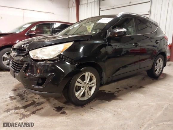 2013 Hyundai Tucson GLS with VIN KM8JU3AC0DU754948, listed as a IAAI auction lot 41811891 with 139,056 mi miles. Bid and sale history available at carsss.com. Image 22.