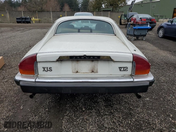 1989 Jaguar XJS z VIN SAJNA5840KC150684, wystawiony jako Copart lot #48081805 z przebiegiem 93 444 mil mil oraz Czysty tytuł • Clean title. Historia ofert i sprzedaży dostępna na DreamBid. Obrazek 6.