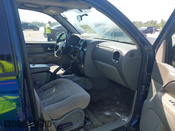 2004 GMC Envoy SLE with VIN 1GKDT13S242391968, listed as a IAAI auction lot 42079420 with 234,611 mi miles. Bid and sale history available at carsss.com. Image 5.