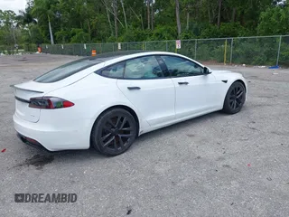 2022 Tesla Model S Plaid with VIN 5YJSA1E61NF460155, listed as a IAAI auction lot 42545167 with 51,711 mi miles and . Bid and sale history available at DreamBid. Image 4.
