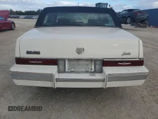 1987 Cadillac Seville z VIN 1G6KS518XHU812739, wystawiony jako Copart lot #79308574 z przebiegiem Nie podano mil oraz Szkoda całkowita • Salvage title. Historia ofert i sprzedaży dostępna na DreamBid. Obrazek 6.