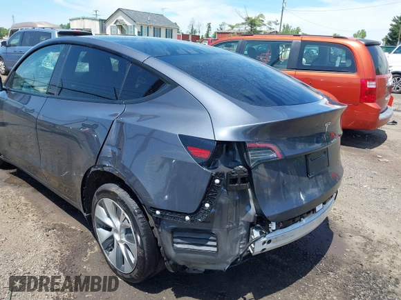 2023 Tesla Model Y Long Range with VIN 7SAYGAEE7PF615751, listed as a IAAI auction lot 42297819 with 31,201 mi miles and . Bid and sale history available at DreamBid. Image 20.
