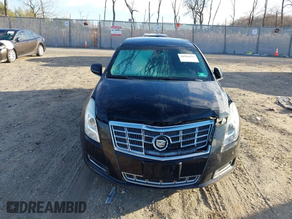 2013 Cadillac XTS z VIN 2G61N5S32D9238652, wystawiony jako IAAI lot #40966692 z przebiegiem 90 834 mil mil oraz . Historia ofert i sprzedaży dostępna na DreamBid. Obrazek 12.