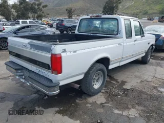 1996 Ford F-150 with VIN 1FTEX15H9TKA56551, listed as a IAAI auction lot 41674788 with 314,443 mi miles. Bid and sale history available at carsss.com. Image 4.