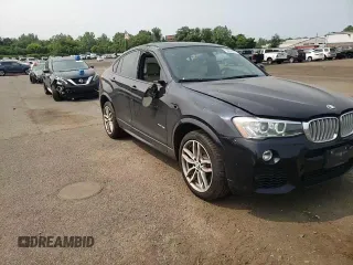 2015 BMW X4 xDrive35i with VIN 5UXXW5C59F0E87517, listed as a Copart auction lot 59604445 with 185,064 mi miles and Salvage title. Bid and sale history available at DreamBid. Image 14.