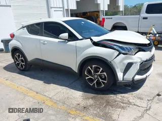 2021 Toyota C-HR LE with VIN JTNKHMBX8M1104427, listed as a IAAI auction lot 41948234 with 24,415 mi miles. Bid and sale history available at carsss.com. Image 1.