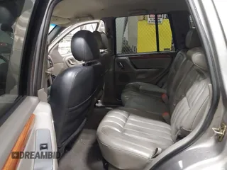 1999 Jeep Grand Cherokee Limited with VIN 1J4GW68N7XC752314, listed as a IAAI auction lot 41776905 with 228,023 mi miles. Bid and sale history available at carsss.com. Image 8.