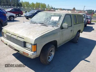 1987 Nissan Hardbody z VIN 1N6ND11S0HC379556, wystawiony jako IAAI lot #42064747 z przebiegiem 294 366 mil mil oraz . Historia ofert i sprzedaży dostępna na DreamBid. Obrazek 2.