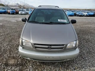 1999 Toyota Sienna LE with VIN 4T3ZF13C7XU133135, listed as a Copart auction lot 80618034 with 200,910 mi miles and Salvage Title. Bid and sale history available at carsss.com. Image 5.