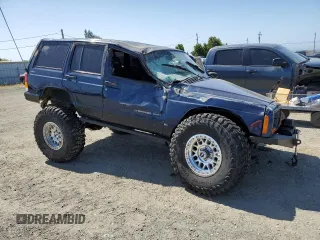 2000 Jeep Cherokee with VIN 1J4FF48S3YL126931, listed as a Copart auction lot 57593305 with Not provided miles and Non repairable. Bid and sale history available at DreamBid. Image 4.