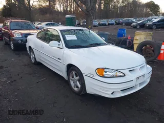 1999 Pontiac Grand Am GT with VIN 1G2NW12E3XM830305, listed as a IAAI auction lot 41797278 with 87,537 mi miles. Bid and sale history available at carsss.com. Image 1.
